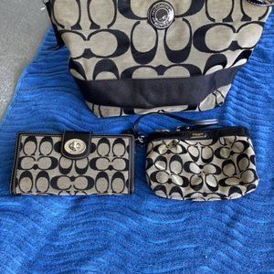 Coach purse, with matching wallet and matching makeup bag.